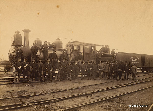 [Yard crew  with Southern Pacific Railroad freight train]