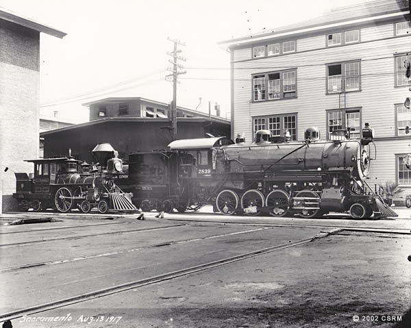 [Southern Pacific Railroad Sacramento Shops complex: exterior view of buildings with steam locomotives]